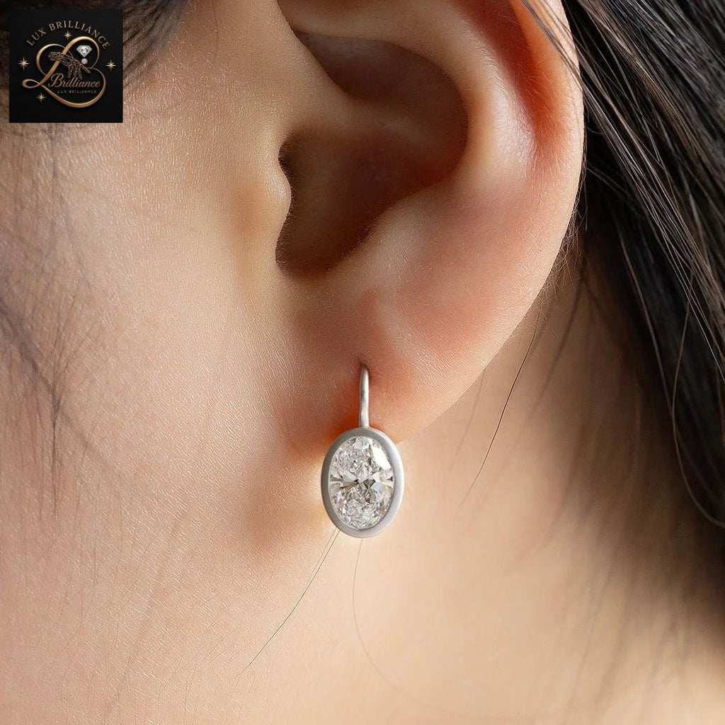 14K White Gold Bezel Oval Diamond Solitaire Earrings | Lever back Dangle