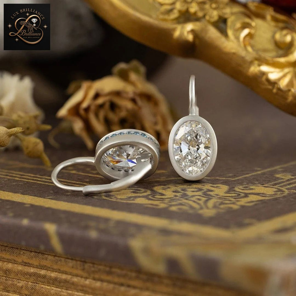 14K White Gold Bezel Oval Diamond Solitaire Earrings | Lever back Dangle